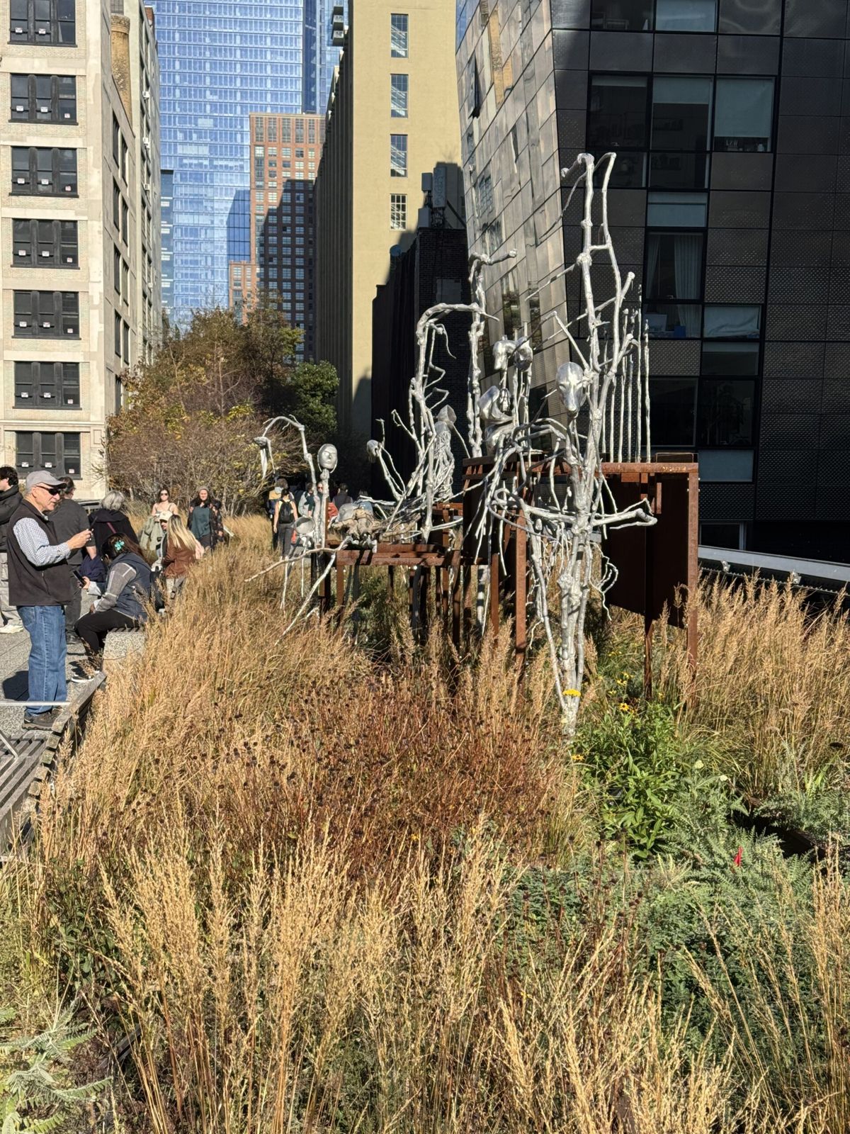 A Halloween exhibit of wiry figures in grass. 