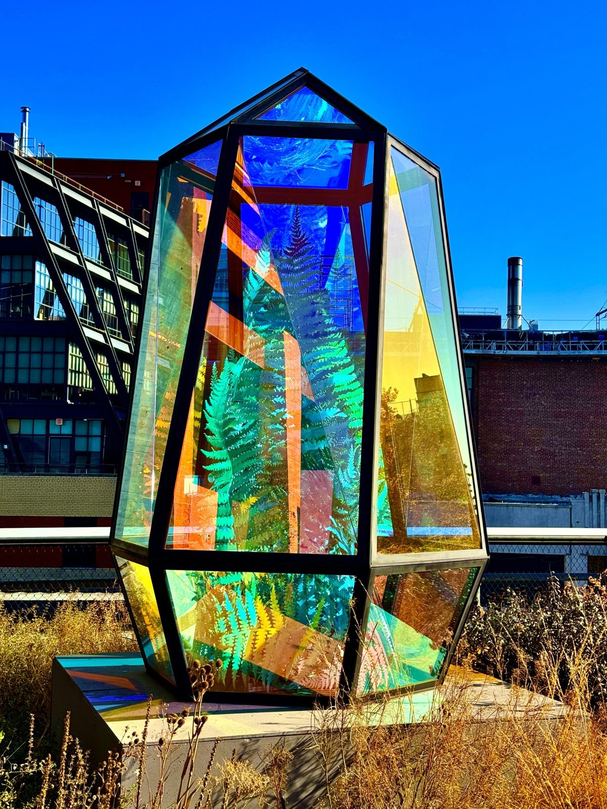 A globe from a lighthouse. The sun is reflecting rainbow colours from its many facets. 